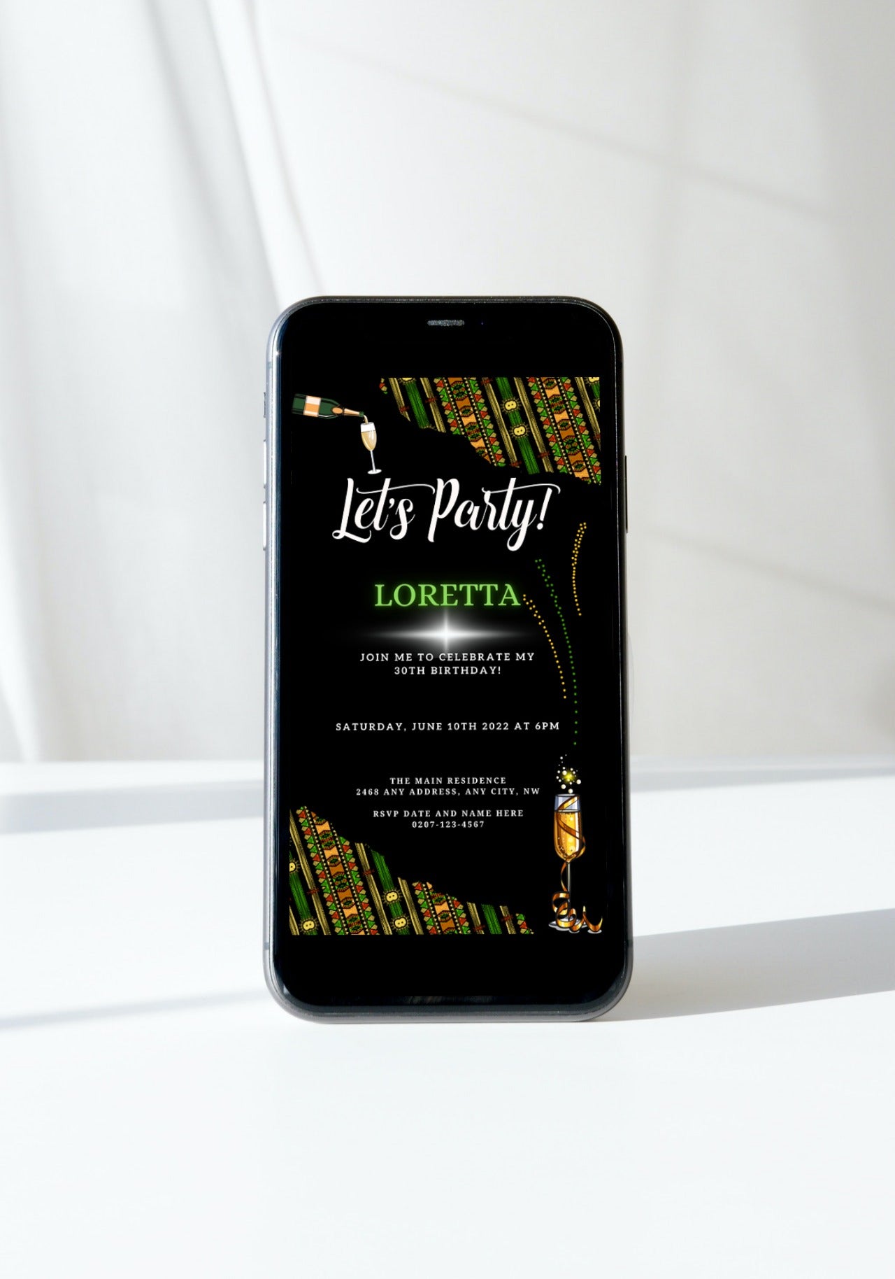 Black smartphone displaying the Green Black African Ankara | Let's Party Evite digital party invitation template, customizable via Canva for easy online sharing.
