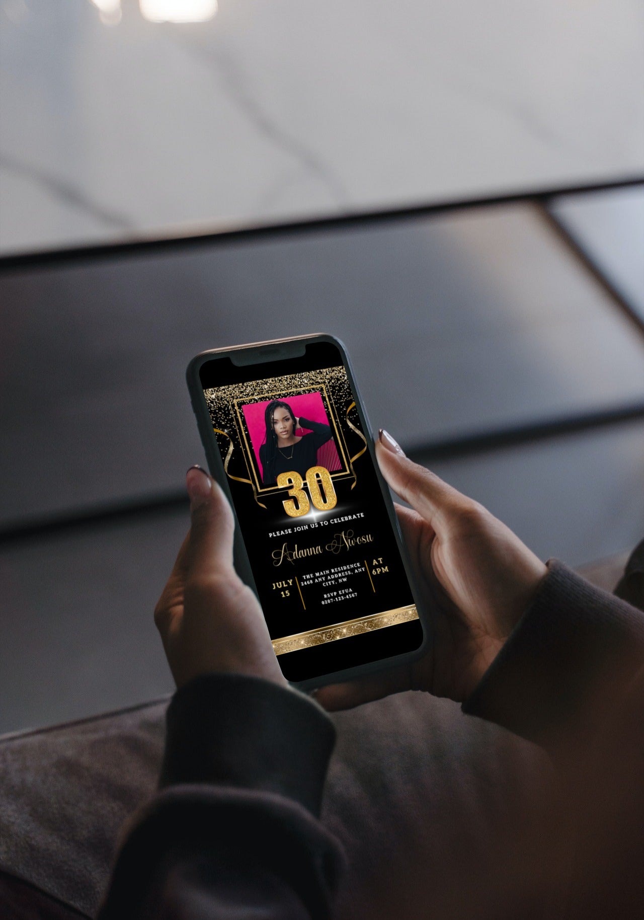 Person holding a smartphone displaying a customizable Black Gold Confetti 30th Birthday Evite with a photo of a woman.