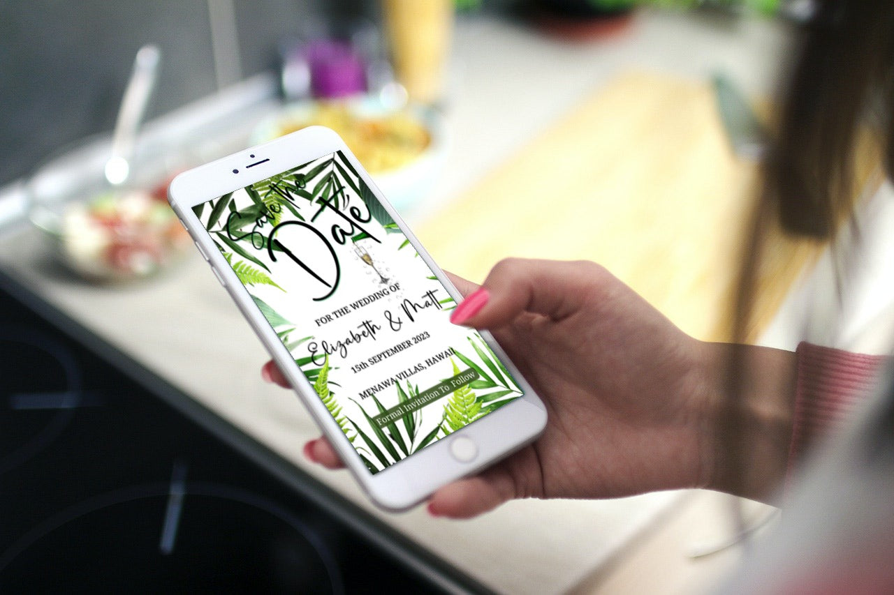 Hand holding a smartphone displaying a white tropical destination Save The Date wedding evite, customizable via Canva for electronic sharing.