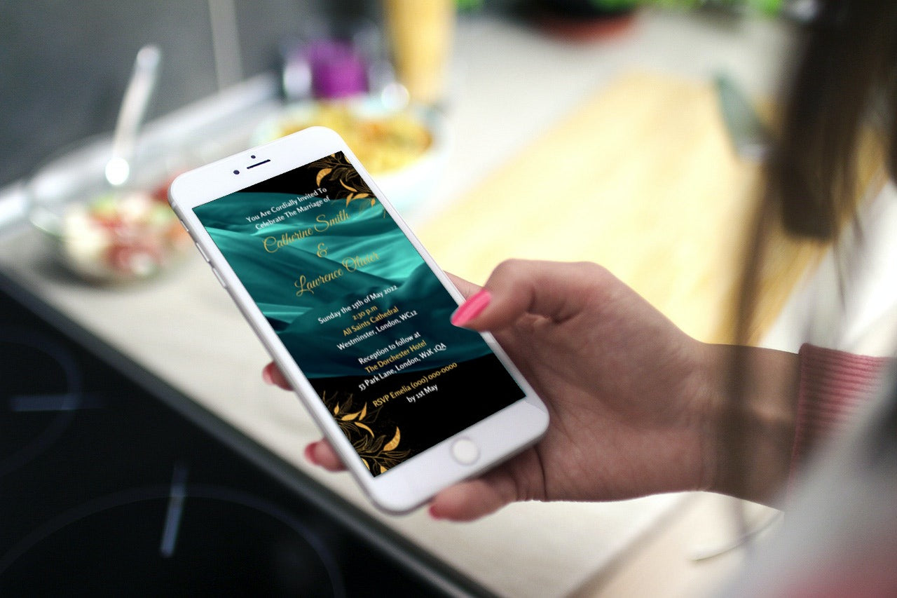 Hand holding a smartphone displaying a customizable Green Silk Chiffon Wedding Video Invitation from URCordiallyInvited.