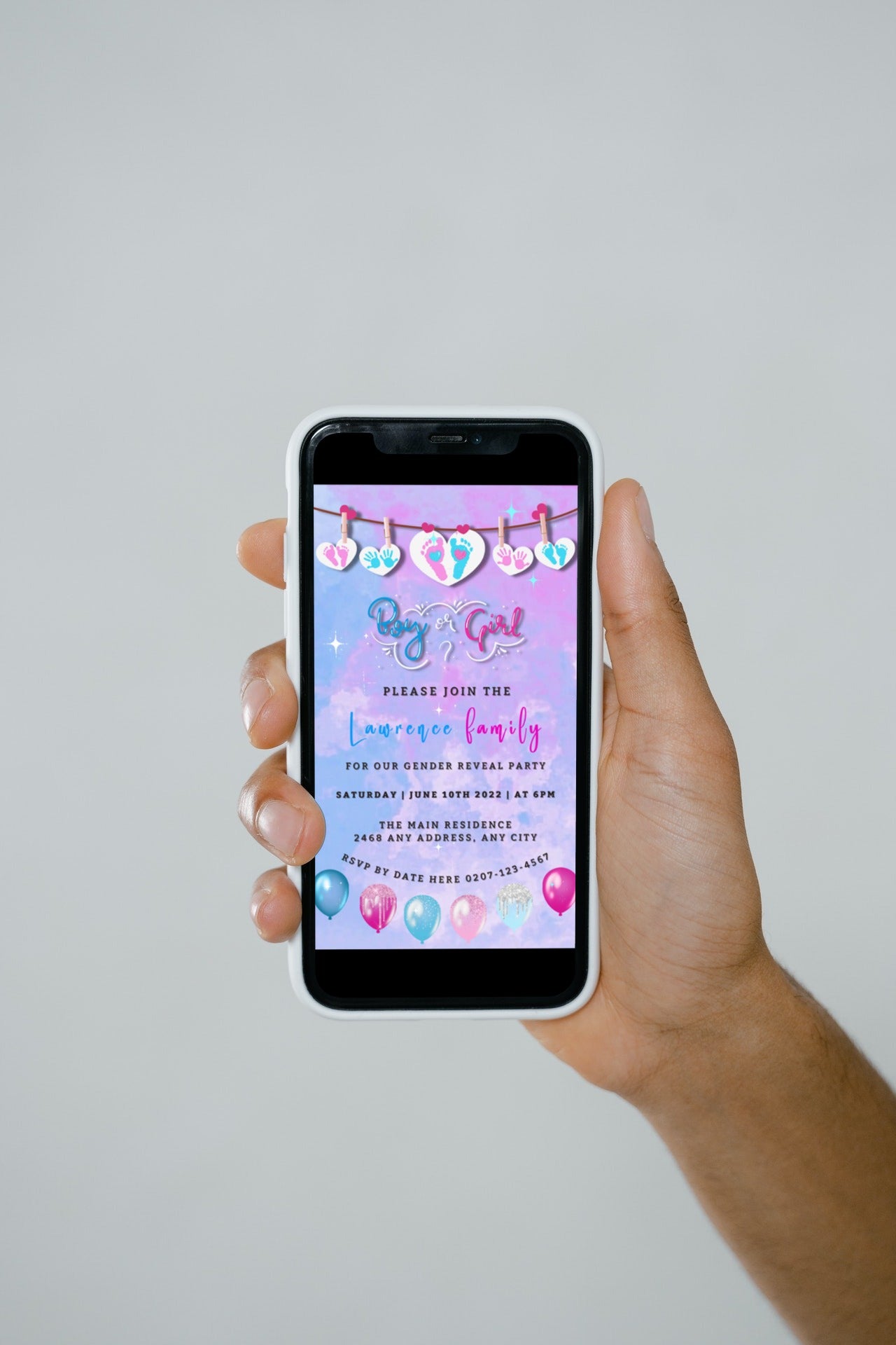 Hand holding a phone displaying a customizable Pink Blue Sky Hearts Gender Reveal Party Video Invitation template from URCordiallyInvited.