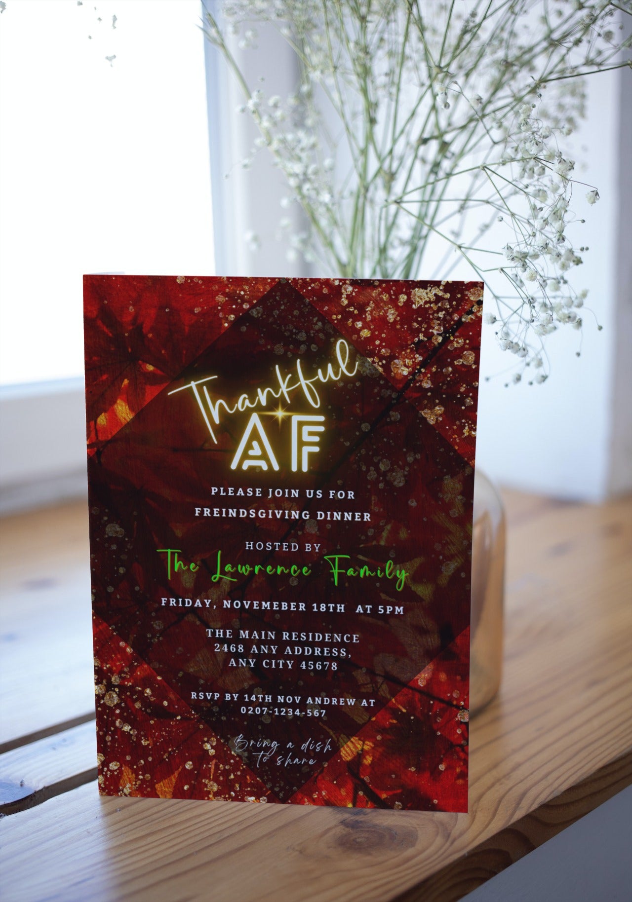 Rustic Red Gold Leafy | Thankful AF Thanksgiving Evite displayed with white flowers on a wooden surface. Customizable digital invitation via Canva.