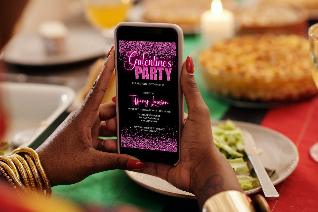 Person holding a phone displaying the Galentines Neon Pink Confetti | Valentines Party Evite, an editable digital invitation template for customizable events.
