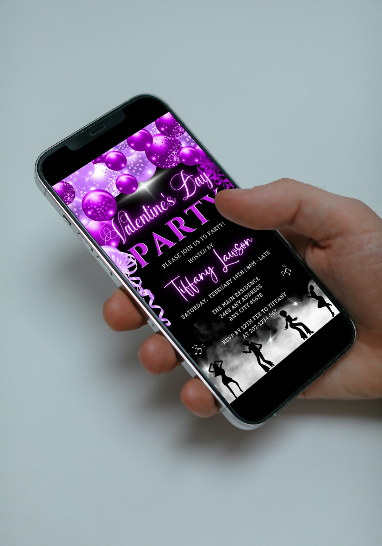 Hand holding a cell phone displaying the Smoking Dancers Neon Purple Valentine's Party Evite, customizable via Canva for digital invitations.