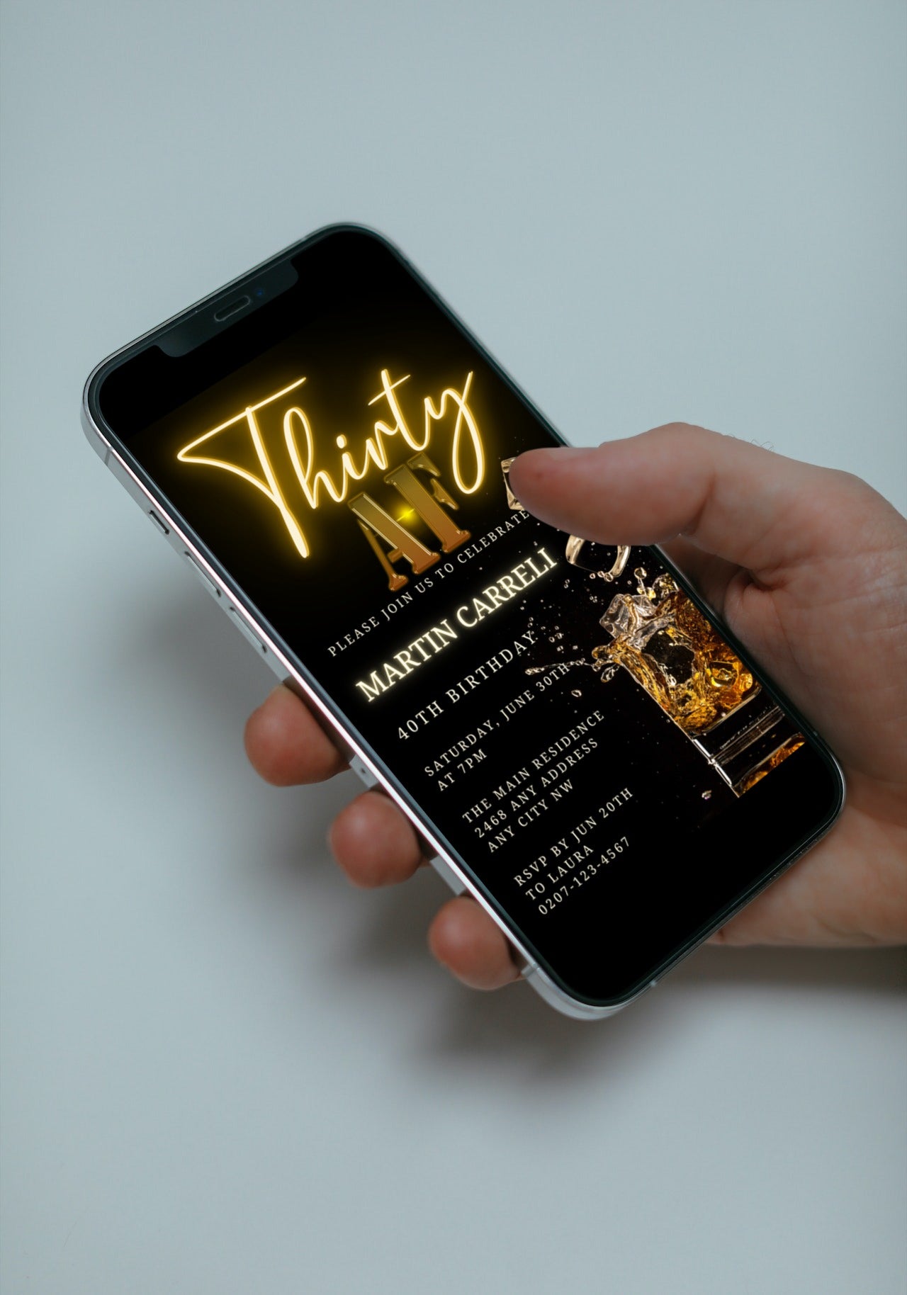 Hand holding a smartphone displaying a customizable Gold Neon Splashing Cubes 30AF Birthday Evite template for digital invitations, editable via the Canva design app.
