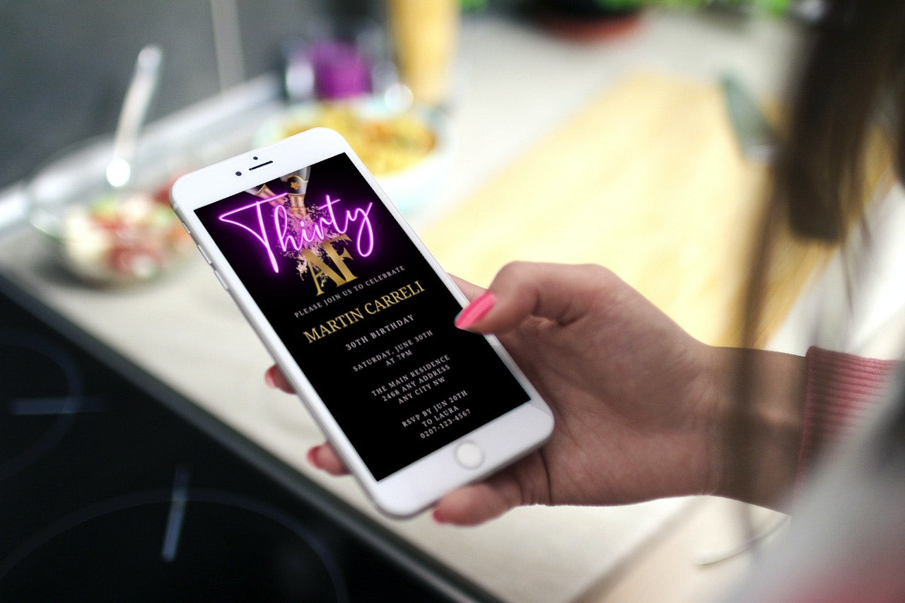Hand holding a smartphone displaying a customizable Black Gold Champagne Neon Purple 30AF Party Evite from URCordiallyInvited, designed for easy personalization using Canva.