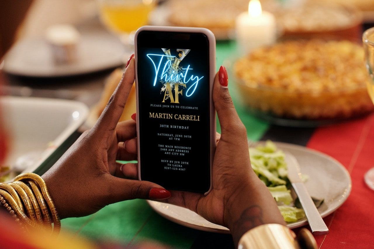 Person holding a smartphone, showcasing the customisable Black Gold Champagne Neon Blue 30AF Party Evite template from URCordiallyInvited.