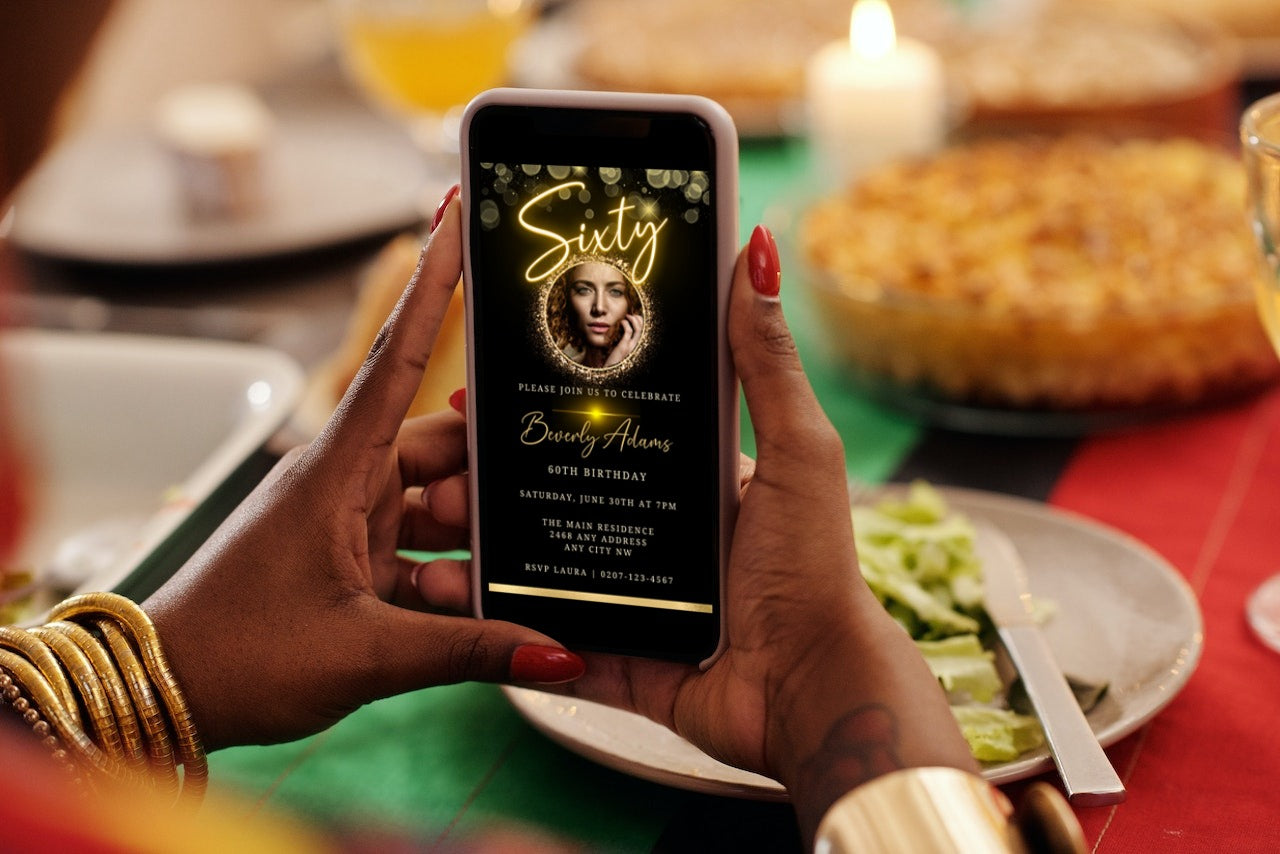 Person holding a smartphone displaying a customizable Gold Neon W/Oval Photo Frame | 60th Birthday Evite template for editing and sharing digitally.