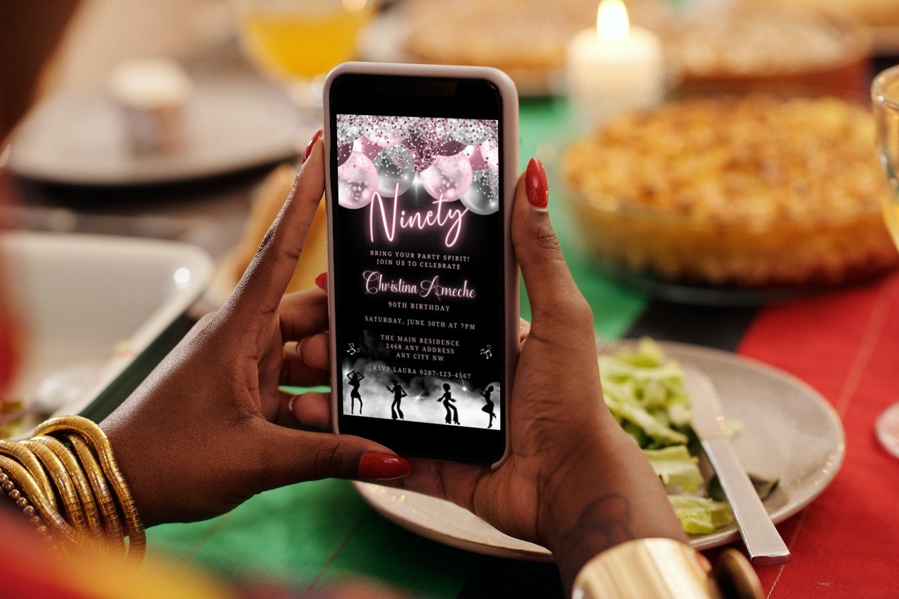 A person holding a smartphone displaying a customizable digital Mauve Pink Silver Neon 90AF Birthday Evite template.