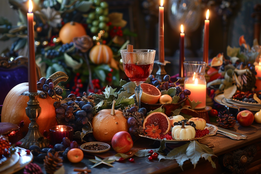 Elegant Thanksgiving potluck table setting with candles, pumpkins, grapes, pomegranate, and festive drinks by URCordiallyInvited