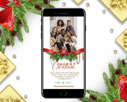 Smartphone displaying a Merry Christmas greeting ecard with a red bow ornament and a family photo. Editable digital template for personalizing invitations via Canva.