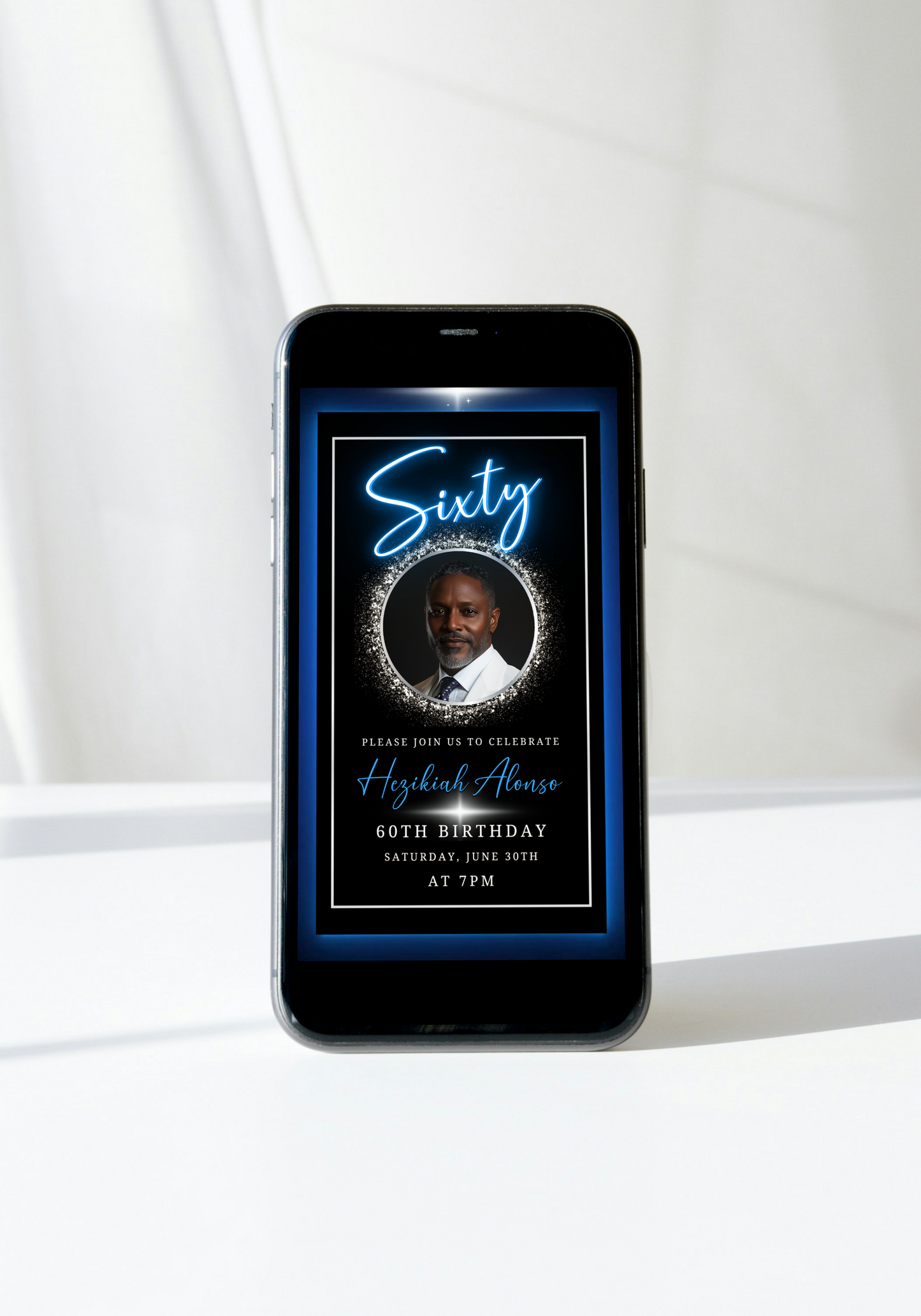 Blue & Silver 60th Birthday Video Invitation displayed on a smartphone screen, featuring an oval photo frame with a man in a white suit and tie.