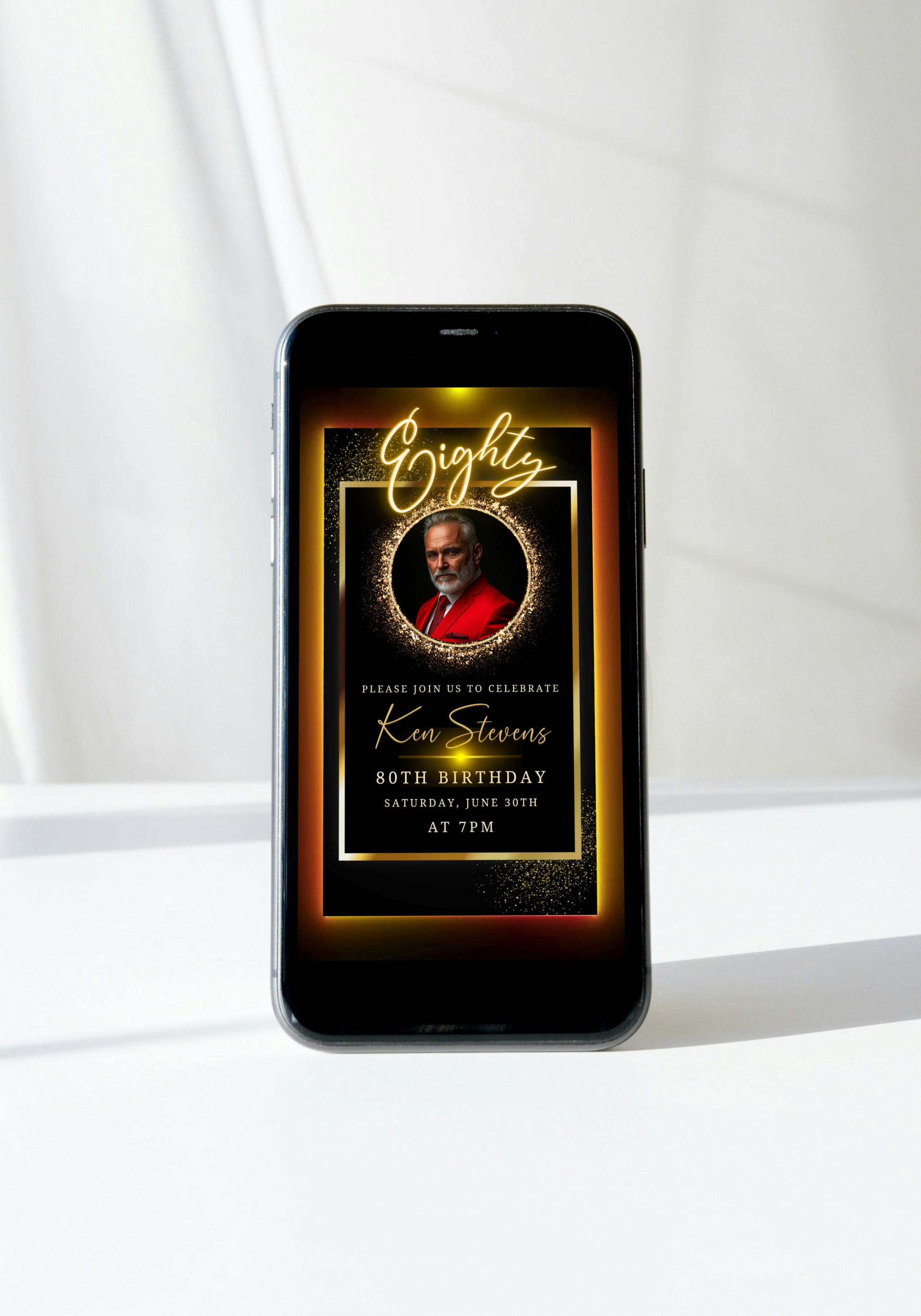 80th Birthday Video Invitation featuring a man in a red suit on a phone screen, showcasing an elegant black and gold oval photo frame design.