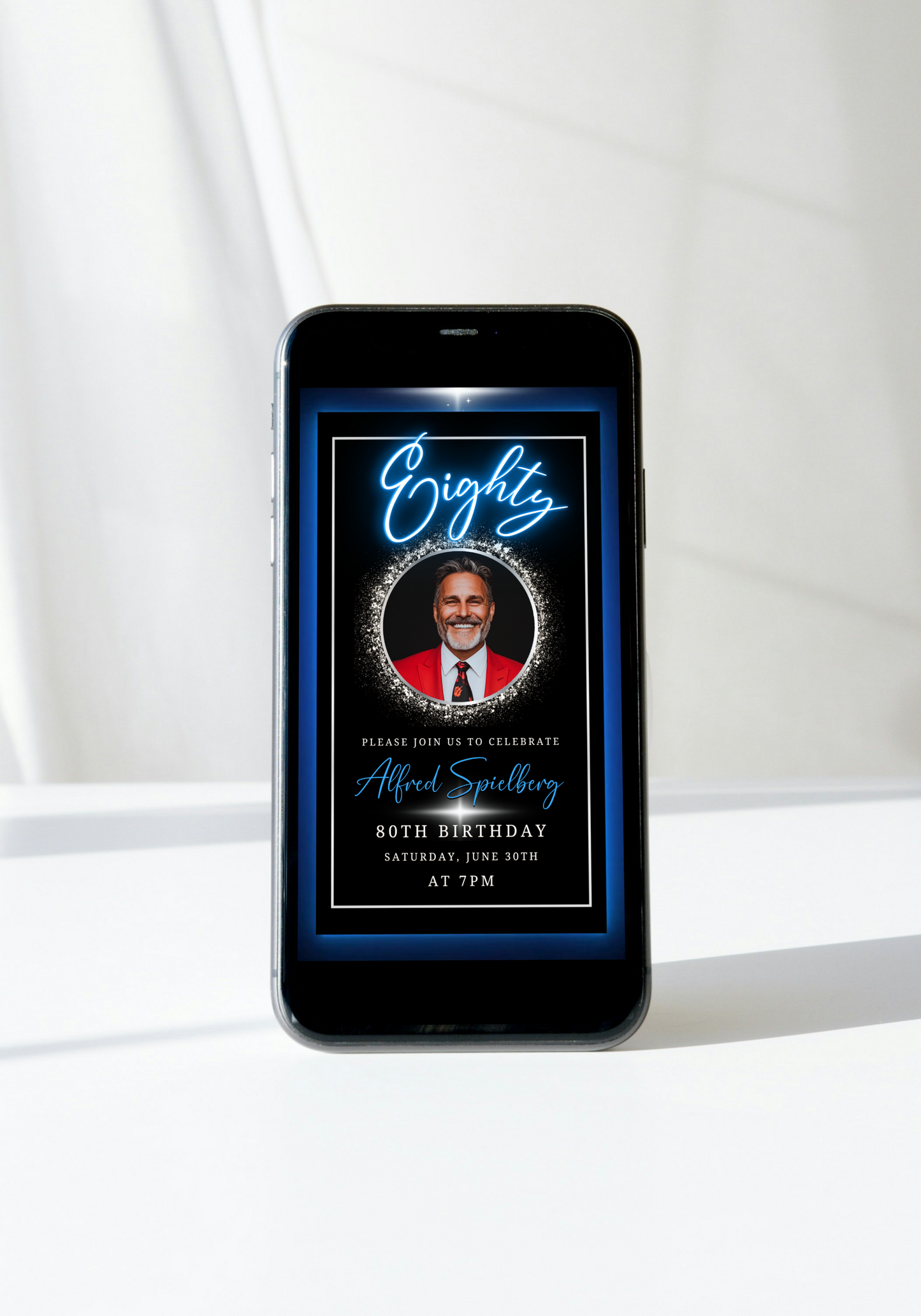 Blue & Silver 70th Birthday Video Invitation displayed on a mobile screen featuring a man in a red suit, highlighting the customizable digital invitation design.