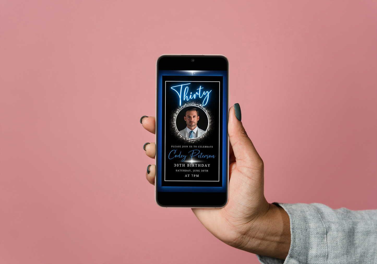 Blue & Silver 30th Birthday Video Invitation features a man holding a smartphone displaying the elegant, customisable neon design for men's milestone celebrations.