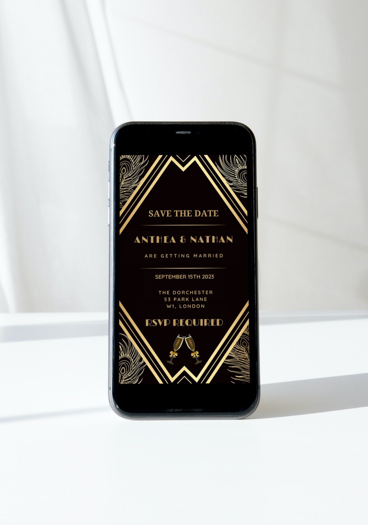 Gatsby Art Deco Save The Date Evite, editable digital invitation template displayed on a smartphone, featuring a black and gold design.