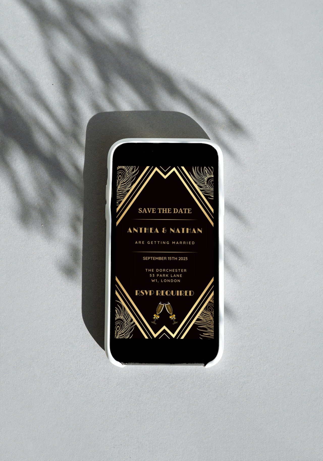 Gatsby Art Deco Save The Date Evite displayed on a smartphone, featuring black and gold design elements for easy personalisation via Canva.