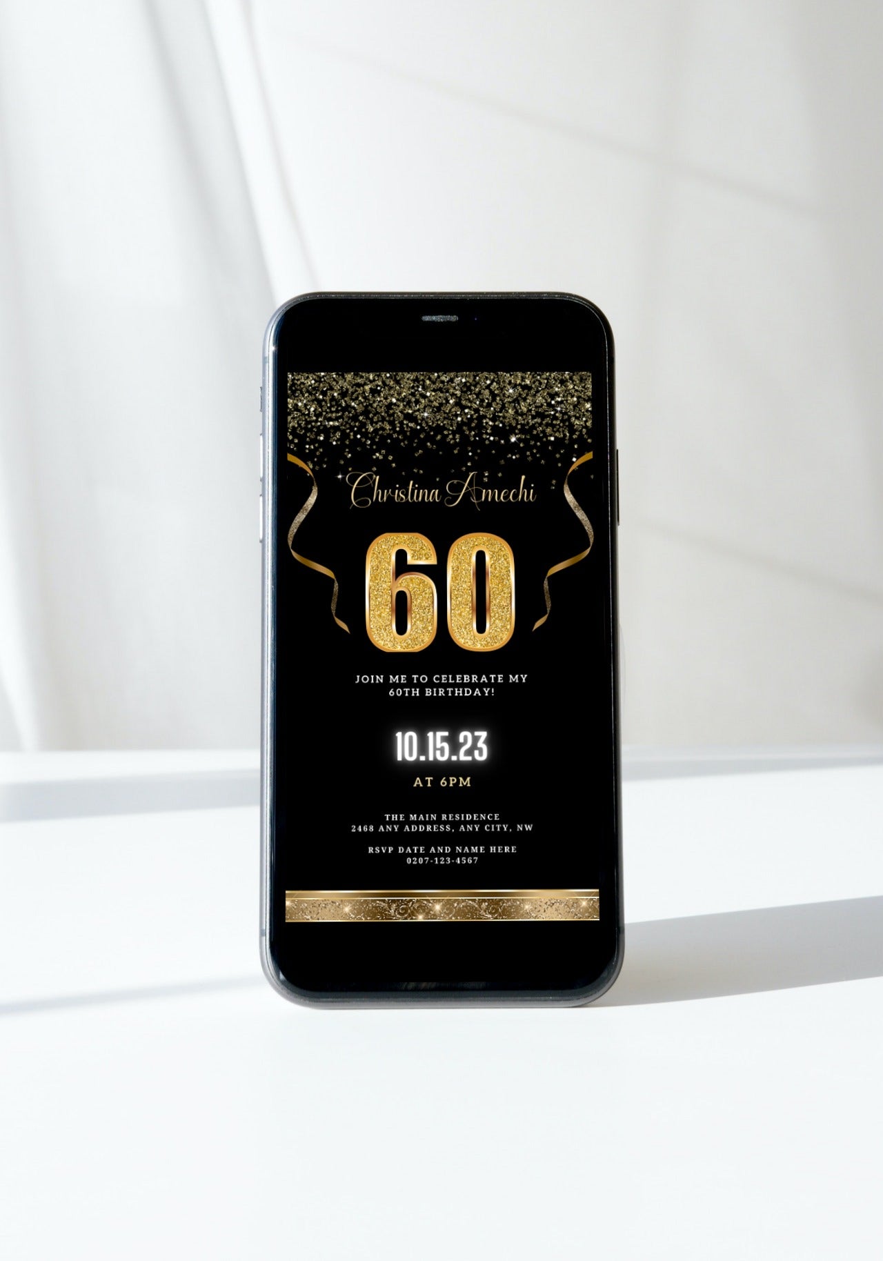 Black Gold Confetti 60th Birthday Evite displayed on a smartphone screen, showcasing customizable gold text and design elements for a digital invitation.