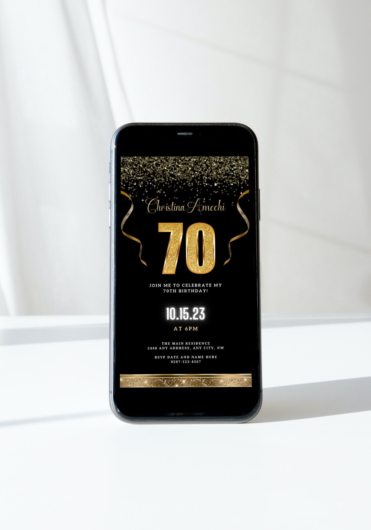 Black Gold Confetti 70th Birthday Evite displayed on a smartphone, showcasing a customizable digital invitation template with celebratory gold text and decorative elements.
