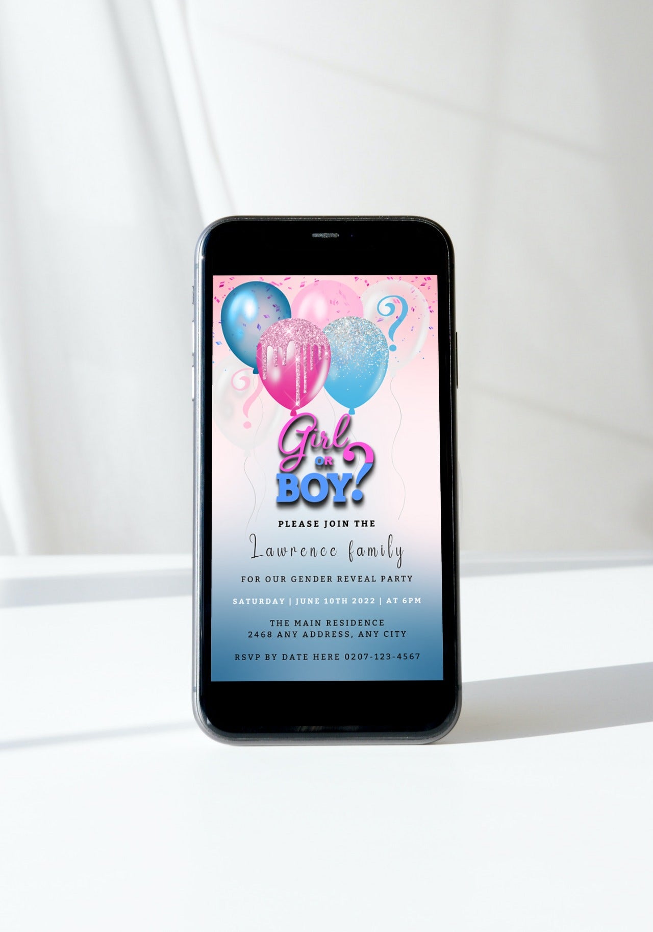 Smartphone displaying a customizable digital invitation with pink and blue floating balloons and glitter for a gender reveal party, editable via Canva.