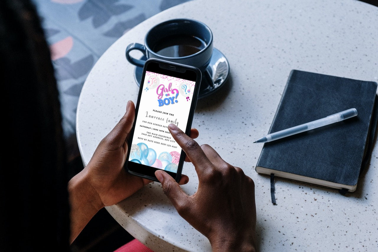 A person holding a smartphone displaying a customizable digital invitation template for a gender reveal party with blue and pink balloons.