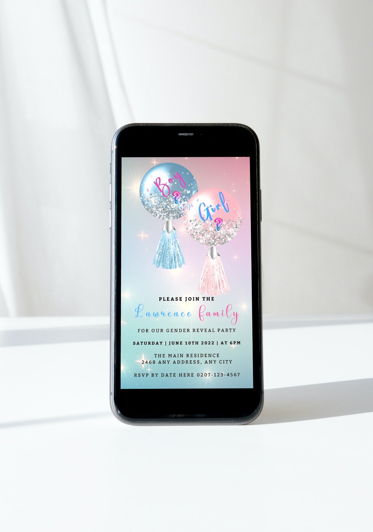Smartphone displaying customizable digital invitation with blue and pink balloons, designed for gender reveal events and editable via Canva.