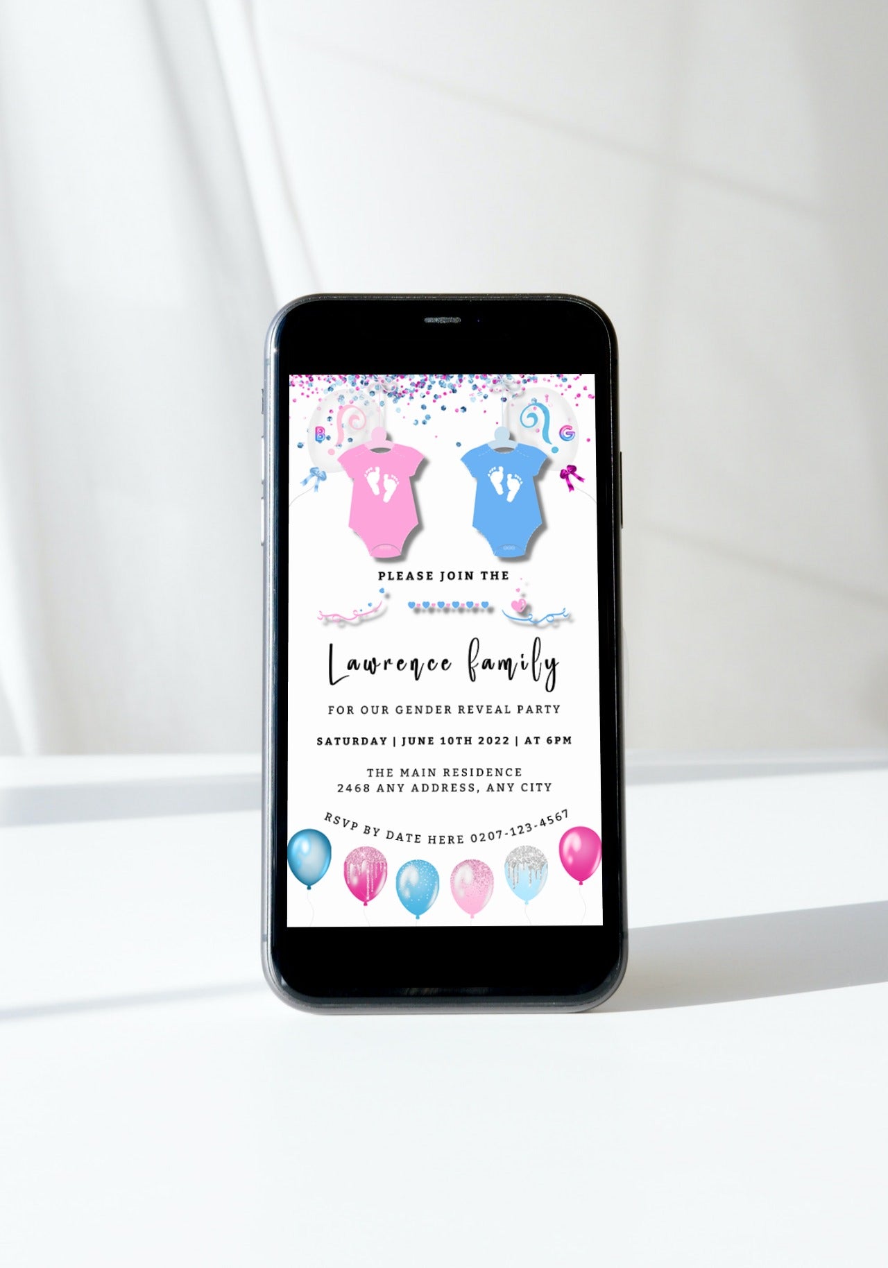 Smartphone displaying Baby Grow Blue Pink Confetti Gender Reveal Evite template, surrounded by baby-themed decorations.