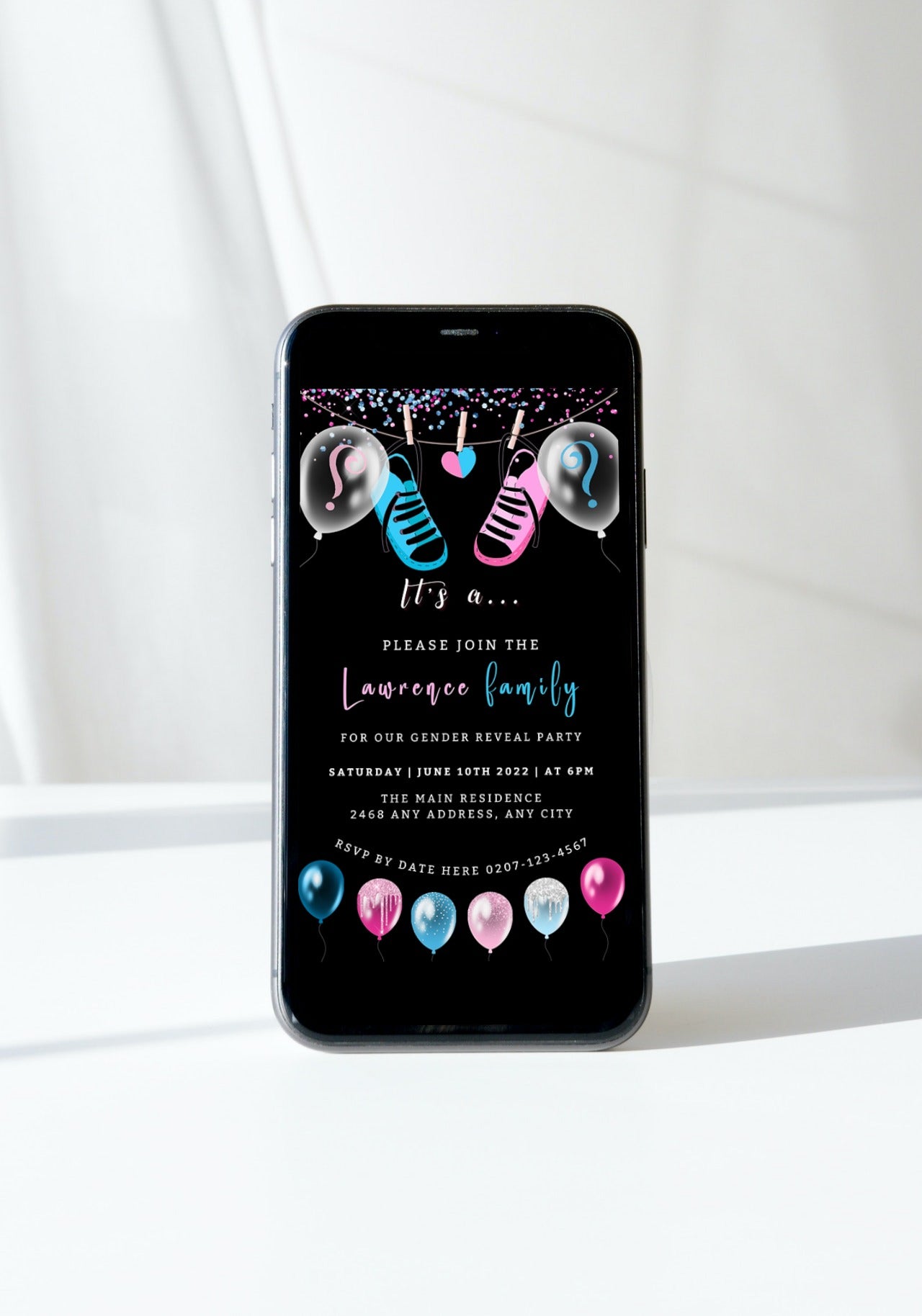 Smartphone displaying customizable baby shower invitation with blue and pink balloons, designed for gender reveal events. Eco-friendly digital template by URCordiallyInvited.