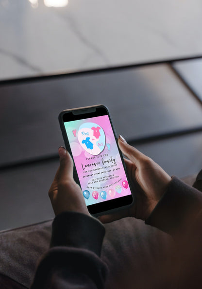 Person holding a smartphone displaying the customizable Pink Blue Baby Grow Bokeh | Gender Reveal Evite invitation template from URCordiallyInvited.