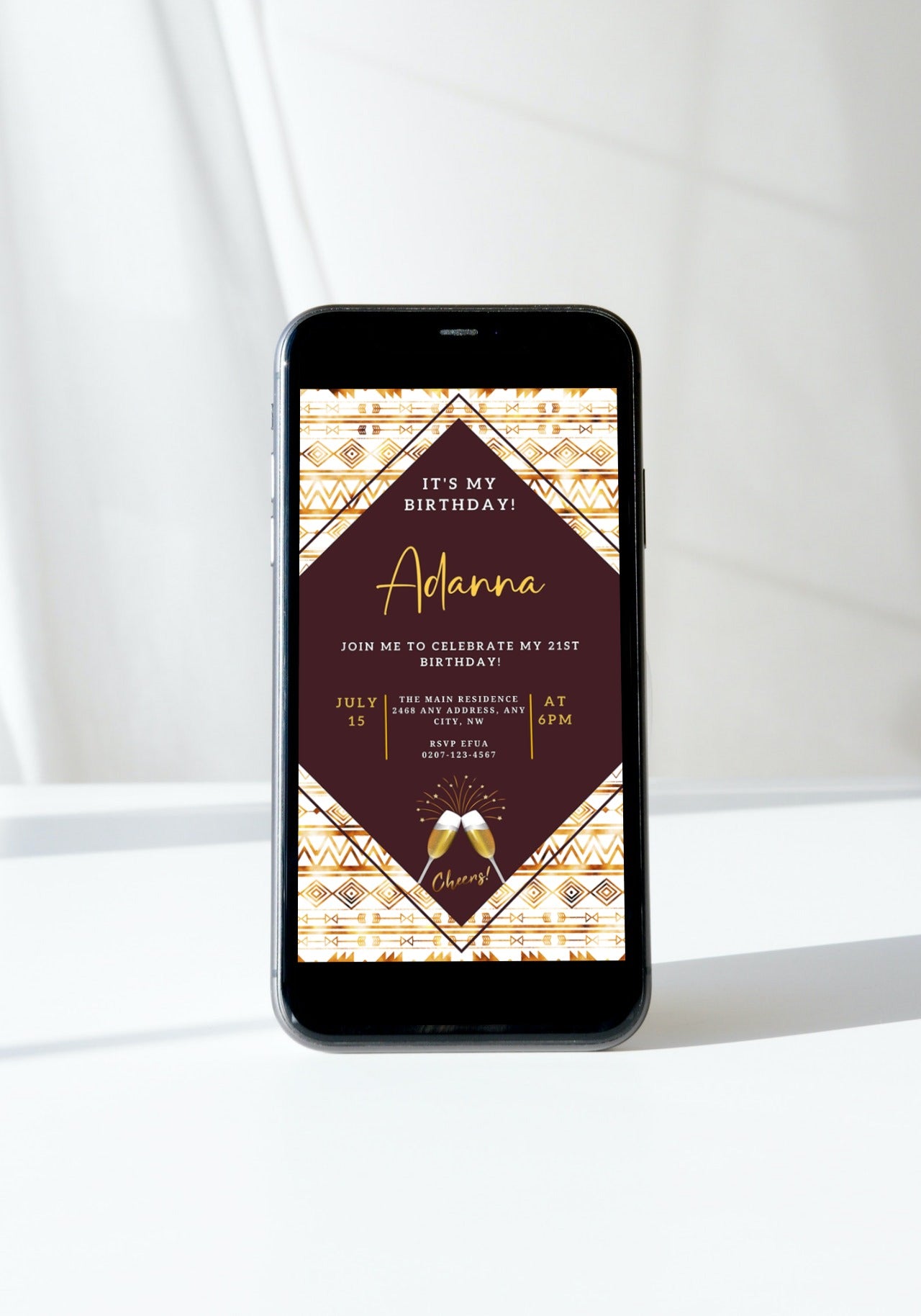 Smartphone displaying an editable Beige White African Ankara birthday invitation template from URCordiallyInvited, featuring a digital customizable design for easy personalization and sharing.
