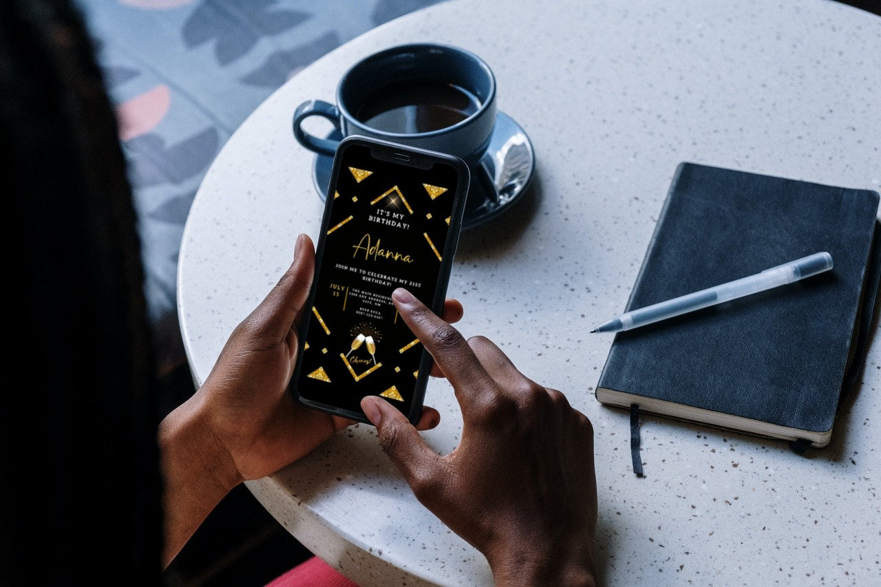 Person holding a smartphone displaying a customizable Gold Black Sparkle Editable Party Evite from URCordiallyInvited, ready for editing via Canva.