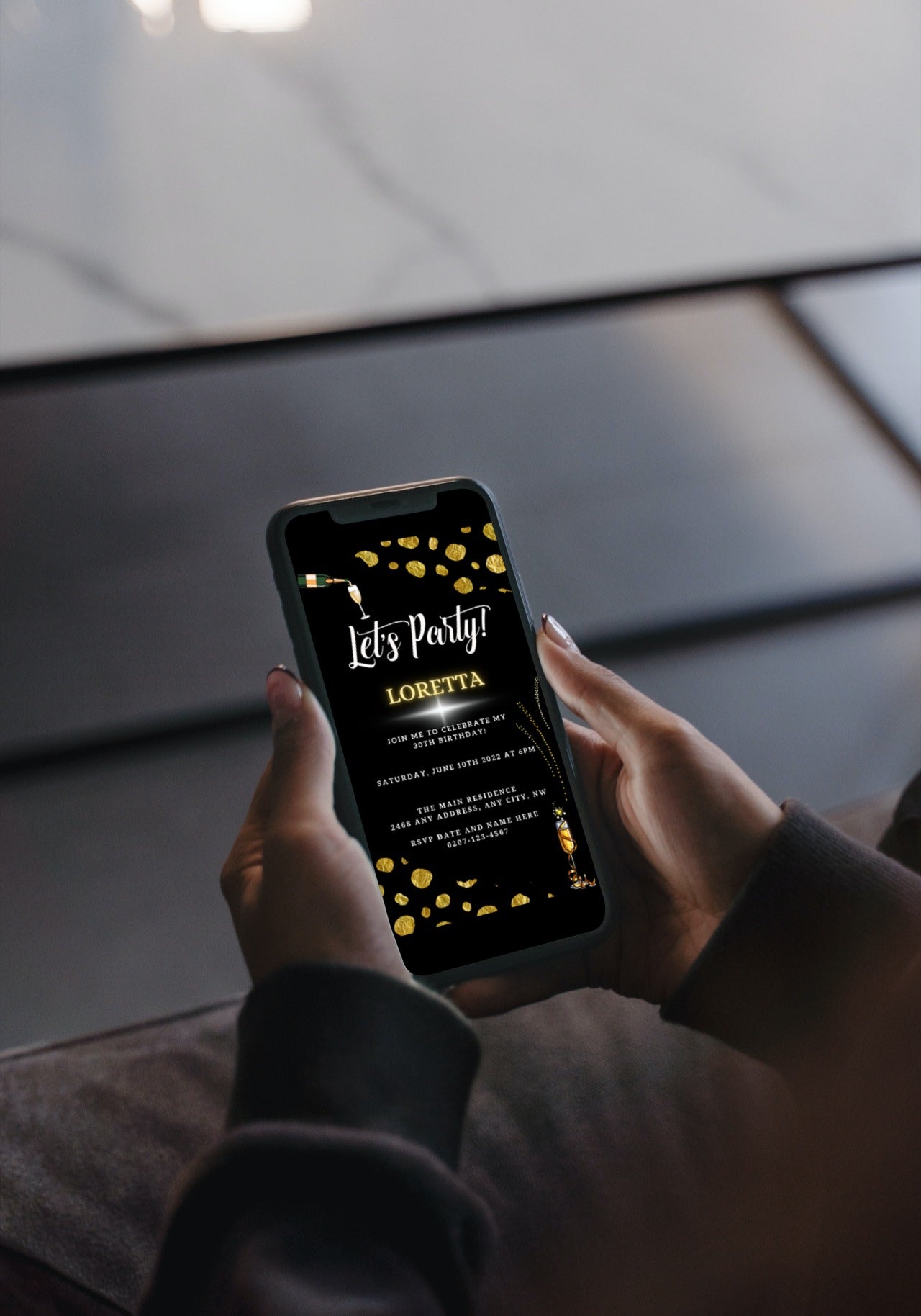 Person holding a phone displaying a Black Leopard Gold Customisable Party Evite for digital invitations, editable via Canva for easy personalization and electronic sharing.