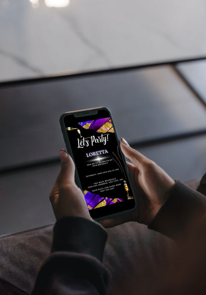 Person holding a smartphone displaying a Purple Gold Ankara Customisable Party Evite template from URCordiallyInvited.