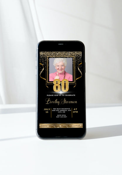 Customizable 80th Birthday Evite featuring a woman's photo on a smartphone screen, with black and gold confetti design, editable using Canva.