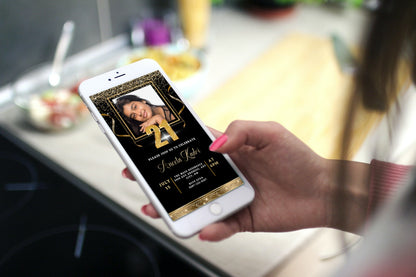 Hand holding smartphone displaying a customizable Black Gold Confetti Photo | 21st Birthday Evite, showcasing a woman's photo on screen.