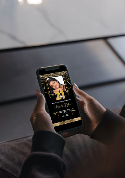 Person holding a smartphone displaying the Black Gold Confetti Photo | 21st Birthday Evite, customizable via Canva for digital invitations.