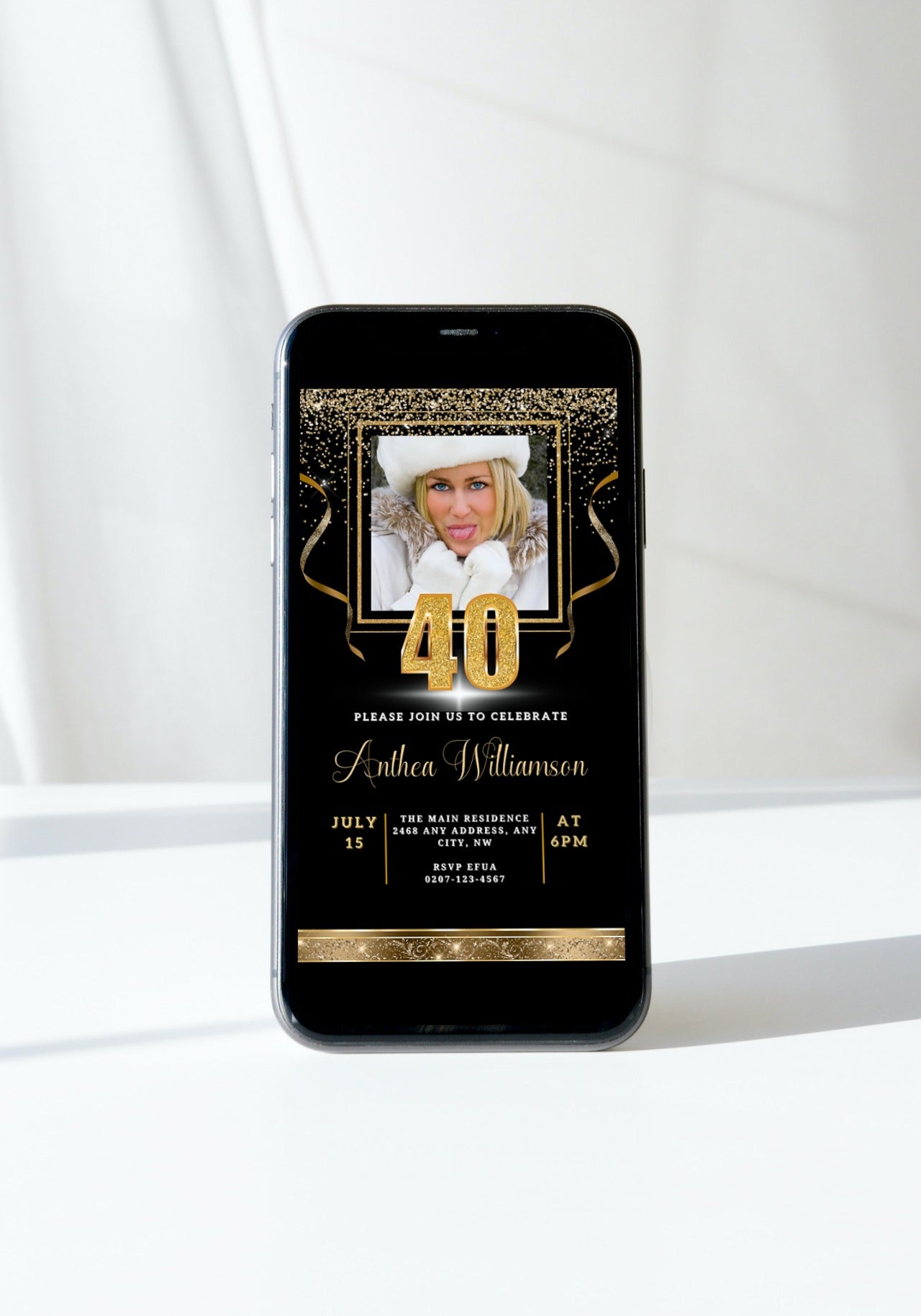 Black Gold Confetti 40th Birthday Evite on a smartphone screen, featuring a woman’s photo. Customizable invitation template for digital sharing via Canva.