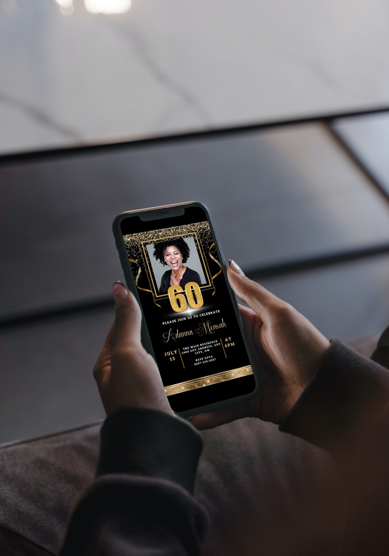 Person holding a smartphone displaying a customizable Black Gold Confetti 60th Birthday Evite with a woman's photo, part of URCordiallyInvited's digital invitation templates.