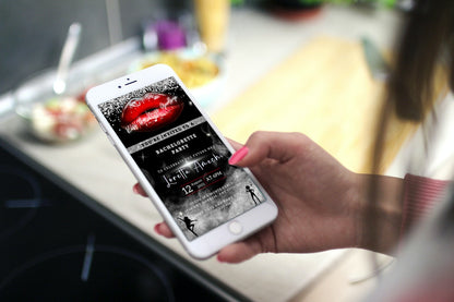 Hand holding a smartphone displaying the customisable digital Red Hot Lips Black Silver Glitter Bachelorette Party Evite from URCordiallyInvited.