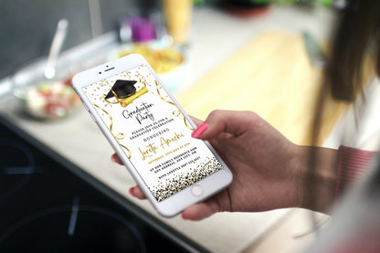 Hand holding a smartphone displaying a Gold & Black Digital Graduation Party Invitation with a graduation cap and diploma graphic, customizable via Canva.