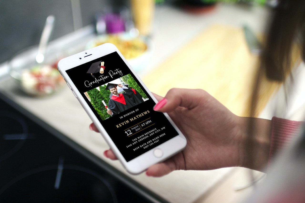 Hand holding a mobile phone displaying a customizable digital graduation invitation template in black and gold, designed for personalization via Canva from URCordiallyInvited.