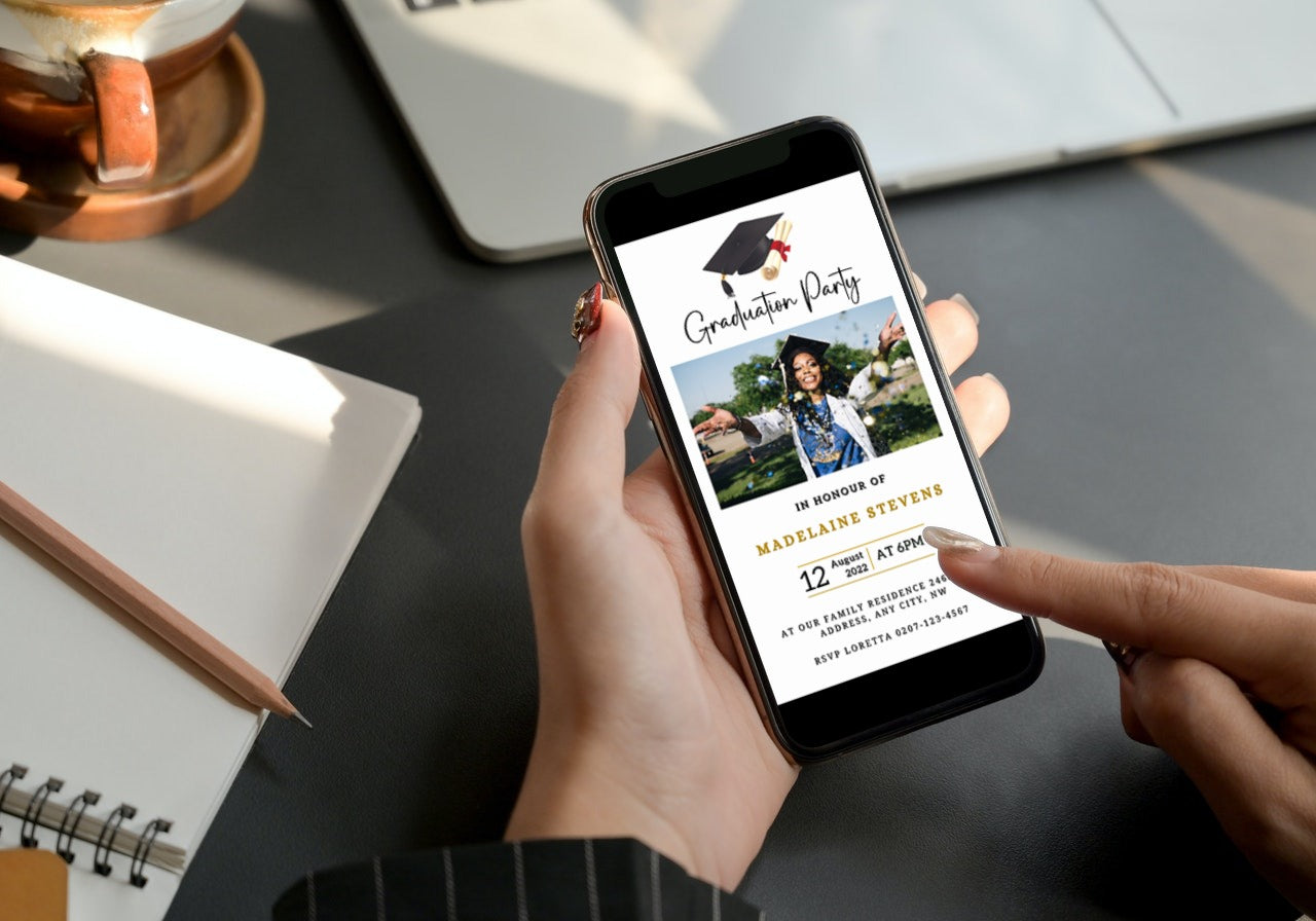 Person holding a phone displaying the White & Gold Graduation Invitation, featuring a glittering cap and confetti design, customizable via Canva for digital sharing.