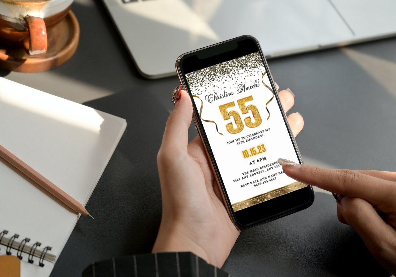 Person holding a phone displaying a customisable White Gold Confetti 55th Birthday Evite from URCordiallyInvited, designed for easy personalization via Canva.