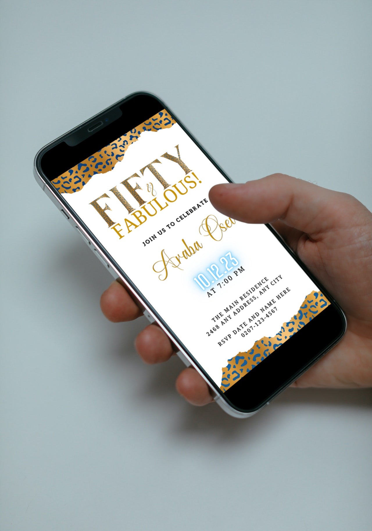 Hand holding a smartphone displaying a customisable Neon Gold Blue White Leopard 50 & Fabulous Party Evite.