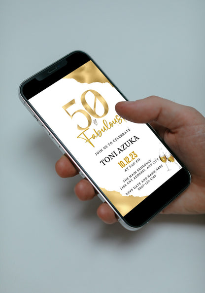 Hand holding a smartphone displaying the customisable Digital Gold White | 50 & Fabulous Party Evite for download and editing via Canva.