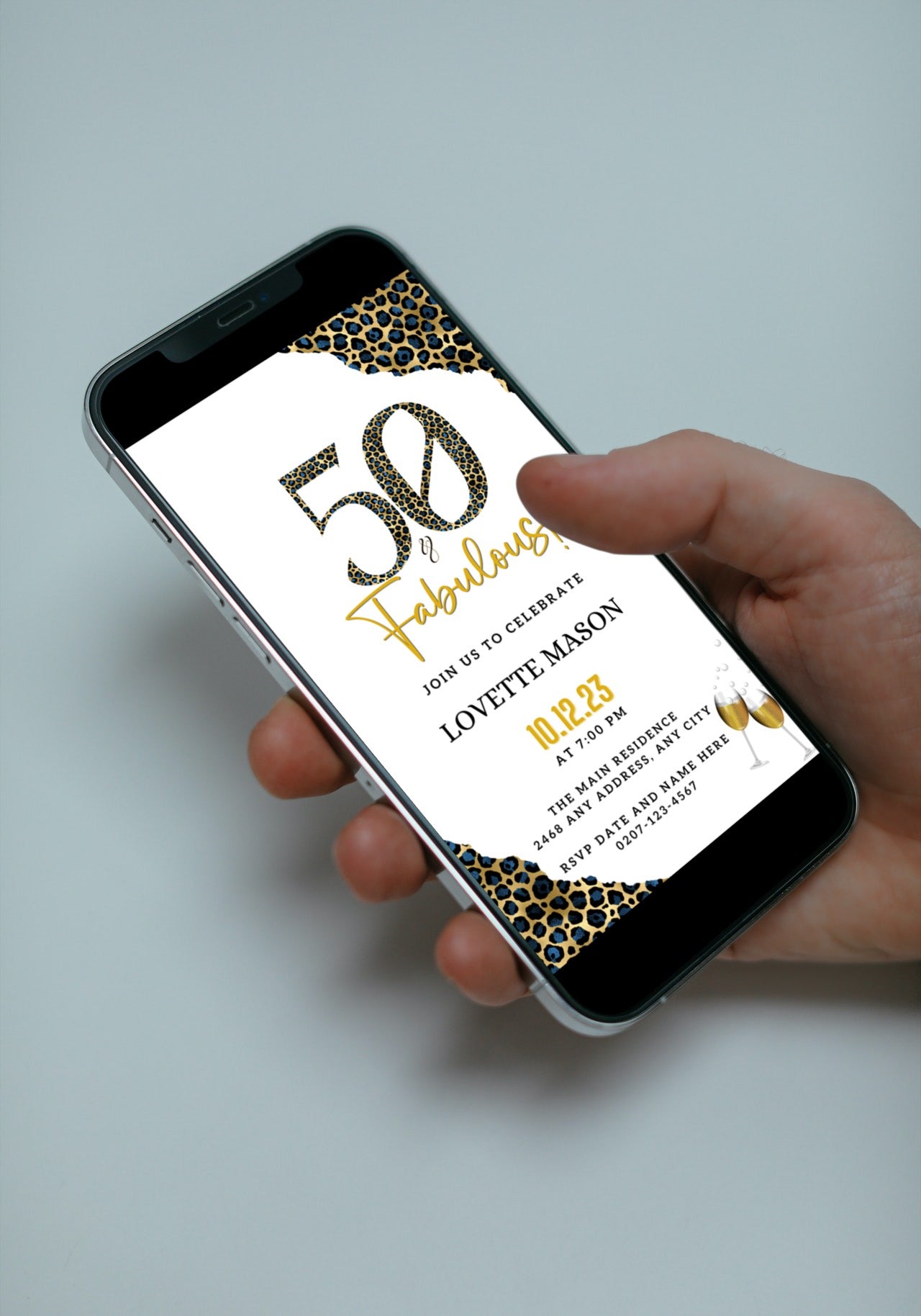 Hand holding a smartphone displaying the customizable Blue Gold Leopard | 50 & Fabulous Party Evite from URCordiallyInvited.