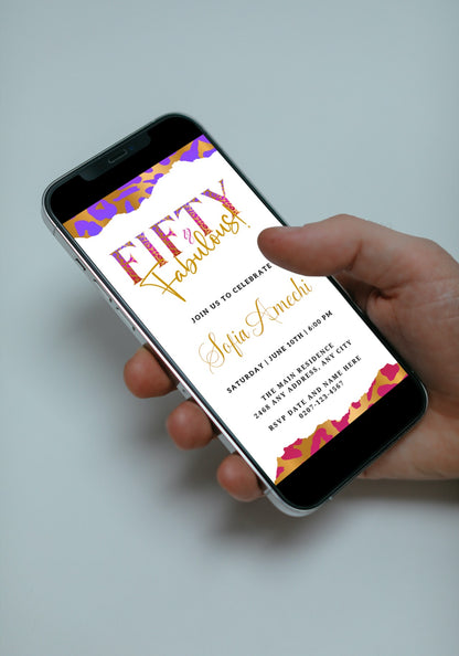 Person holding a smartphone displaying a customisable digital invitation template titled Purple Pink White | Fifty & Fabulous Party Evite from URCordiallyInvited.