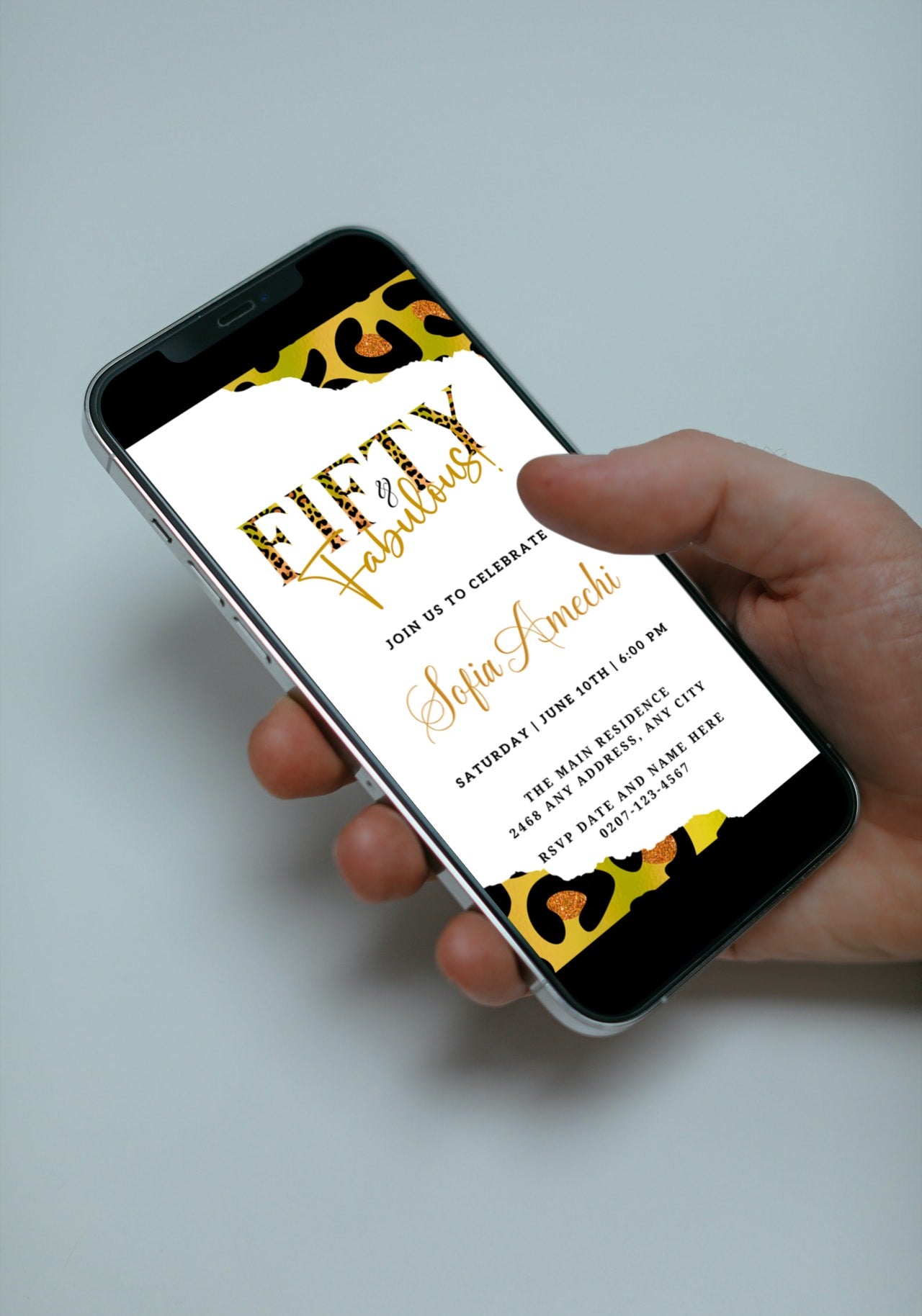 Hand holding a smartphone displaying the customizable Green Gold Neon White Animal Print | Fifty & Fabulous Party Evite from URCordiallyInvited.