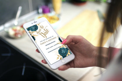 Hand holding a smartphone displaying a Rustic Gold Blue Save The Date Wedding Evite template from URCordiallyInvited, ready for customization in Canva.