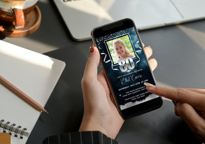 Person holding smartphone displaying customizable Navy Blue Silver Glitter 80th Birthday Evite template with a smiling woman's photo.